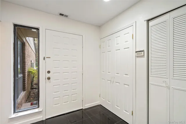 a kitchen with stainless steel appliances a refrigerator and a stove top oven
