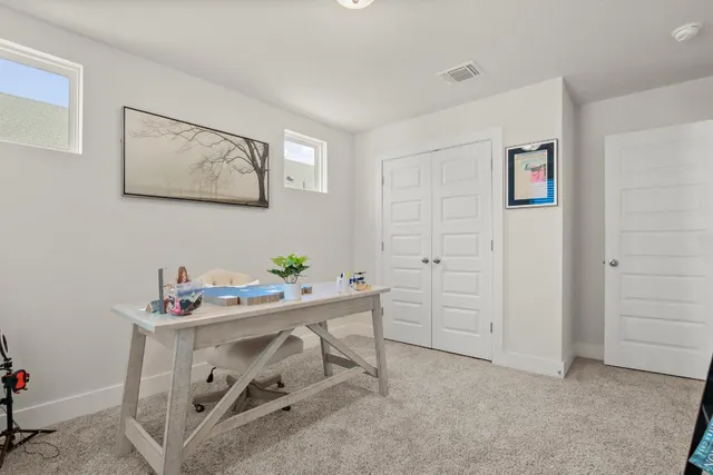 a view of a workspace with furniture