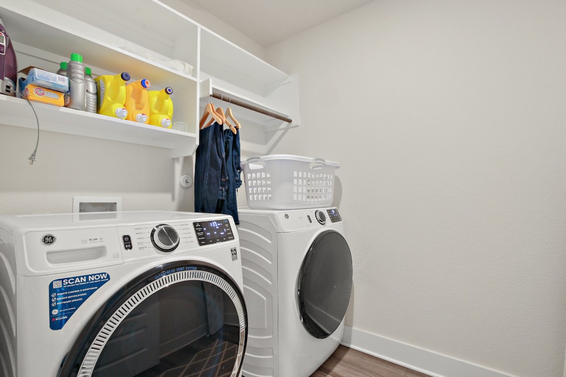 7507 Grand Linden Way Austin, TX 78744 - Photo 17 of 26 a utility room with dryer and washer