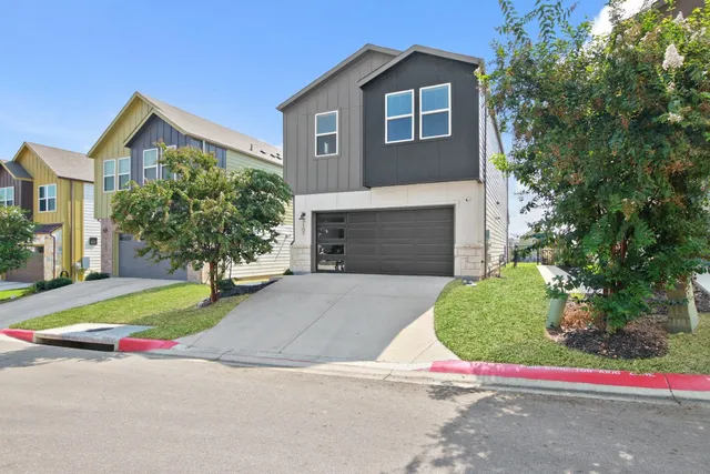 a house with a yard and a large parking space