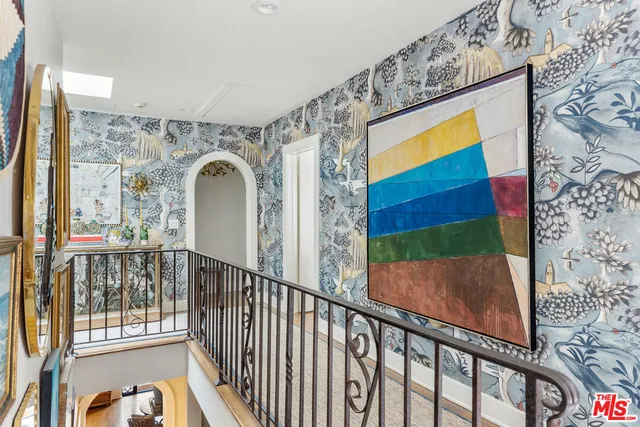 a bedroom with a bed and a fireplace