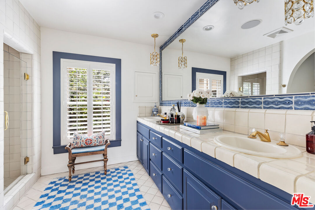 175 West Channel Road Santa Monica, CA 90402 - Photo 22 of 53 a kitchen with a sink and wooden cabinets