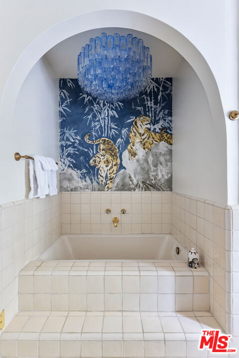 175 West Channel Road Santa Monica, CA 90402 - Photo 24 of 53 a bathroom with a bathtub and shower