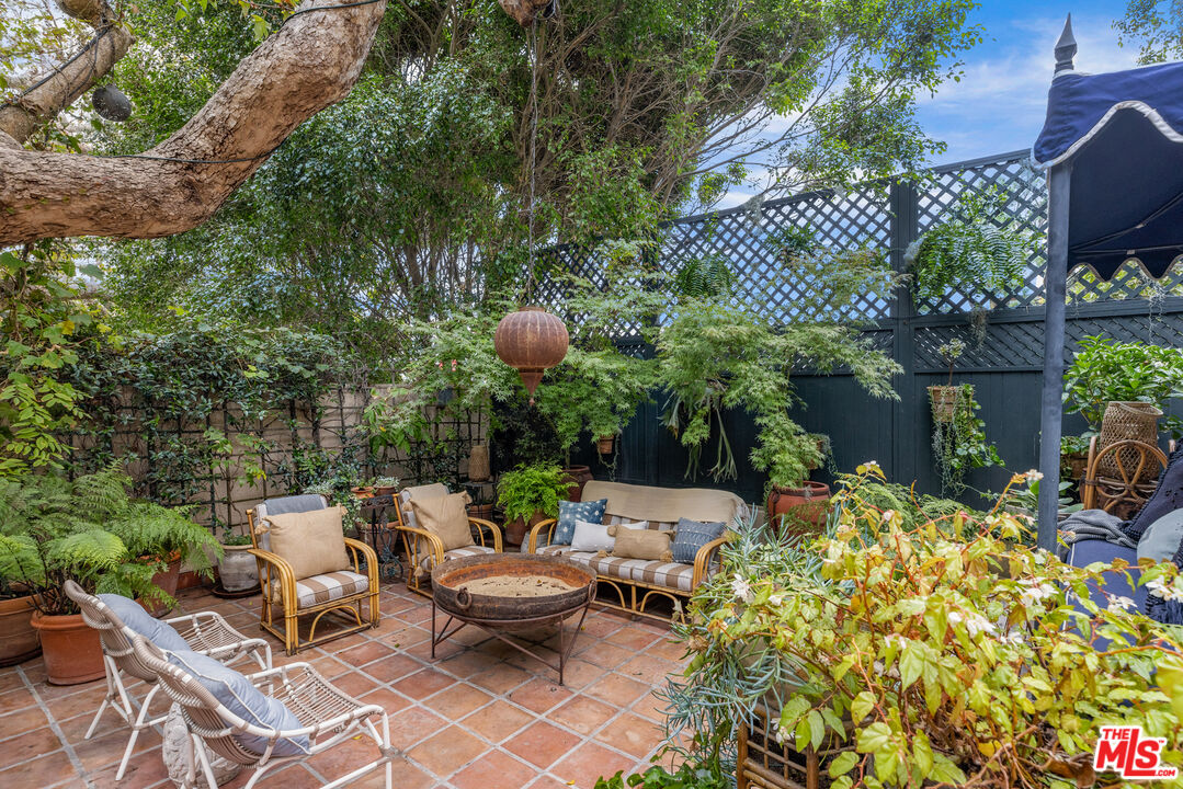 175 West Channel Road Santa Monica, CA 90402 - Photo 34 of 53 a backyard of a house with outdoor seating