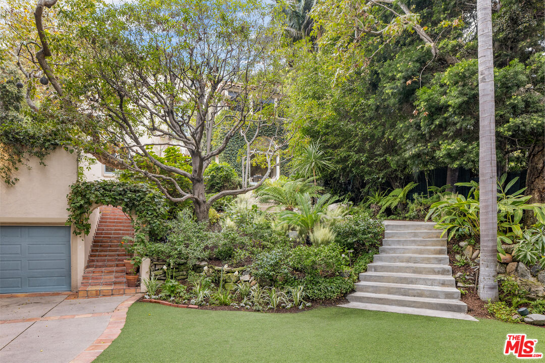 175 West Channel Road Santa Monica, CA 90402 - Photo 38 of 53 a view of a pathway of a house with a yard