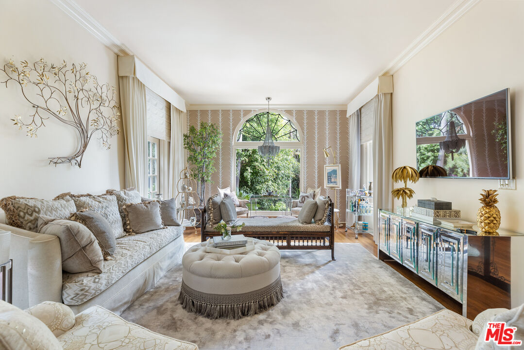 175 West Channel Road Santa Monica, CA 90402 - Photo 4 of 53 a living room with furniture and a large window