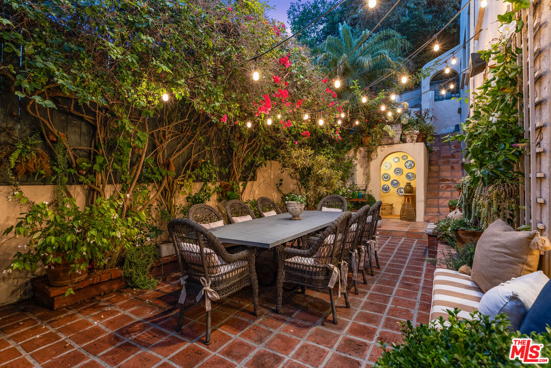 175 West Channel Road Santa Monica, CA 90402 - Photo 47 of 53 a view of a dinning tables and chairs in a patio