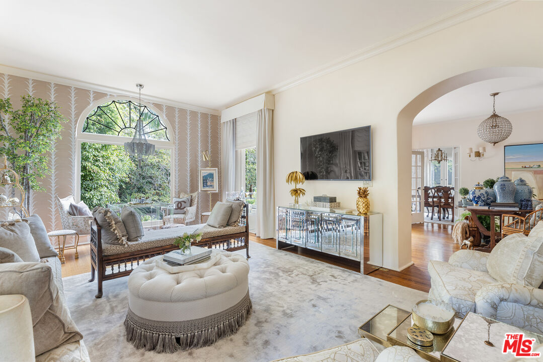 175 West Channel Road Santa Monica, CA 90402 - Photo 5 of 53 a living room with furniture and a flat screen tv