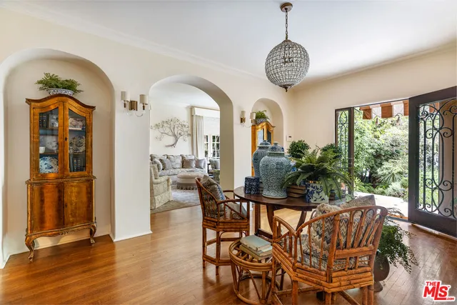 a view of a dining room with furniture window and wooden floor