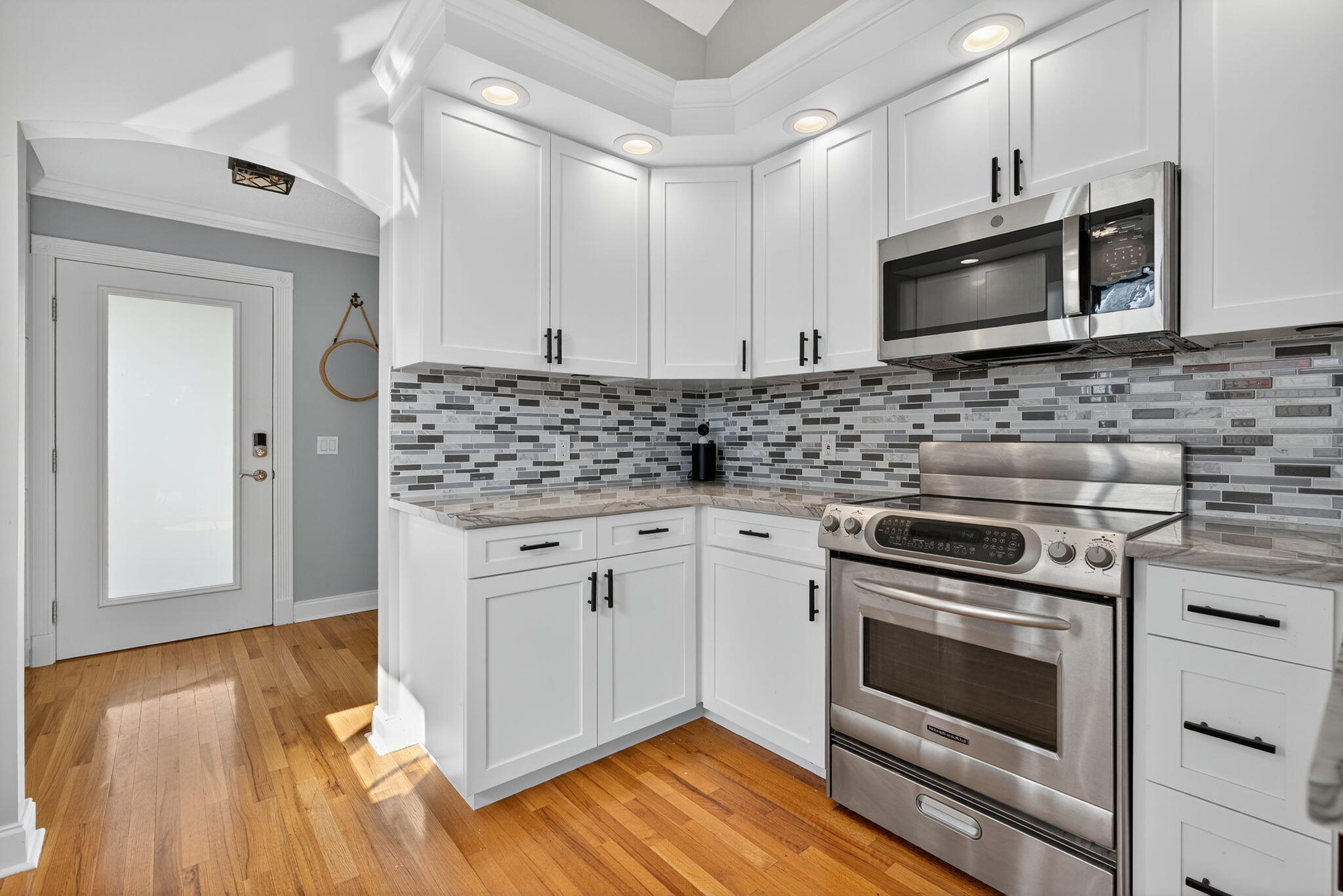 121 Landward Drive Jupiter, FL 33477 - Photo 13 of 80 a kitchen with stainless steel appliances granite countertop a stove and a microwave