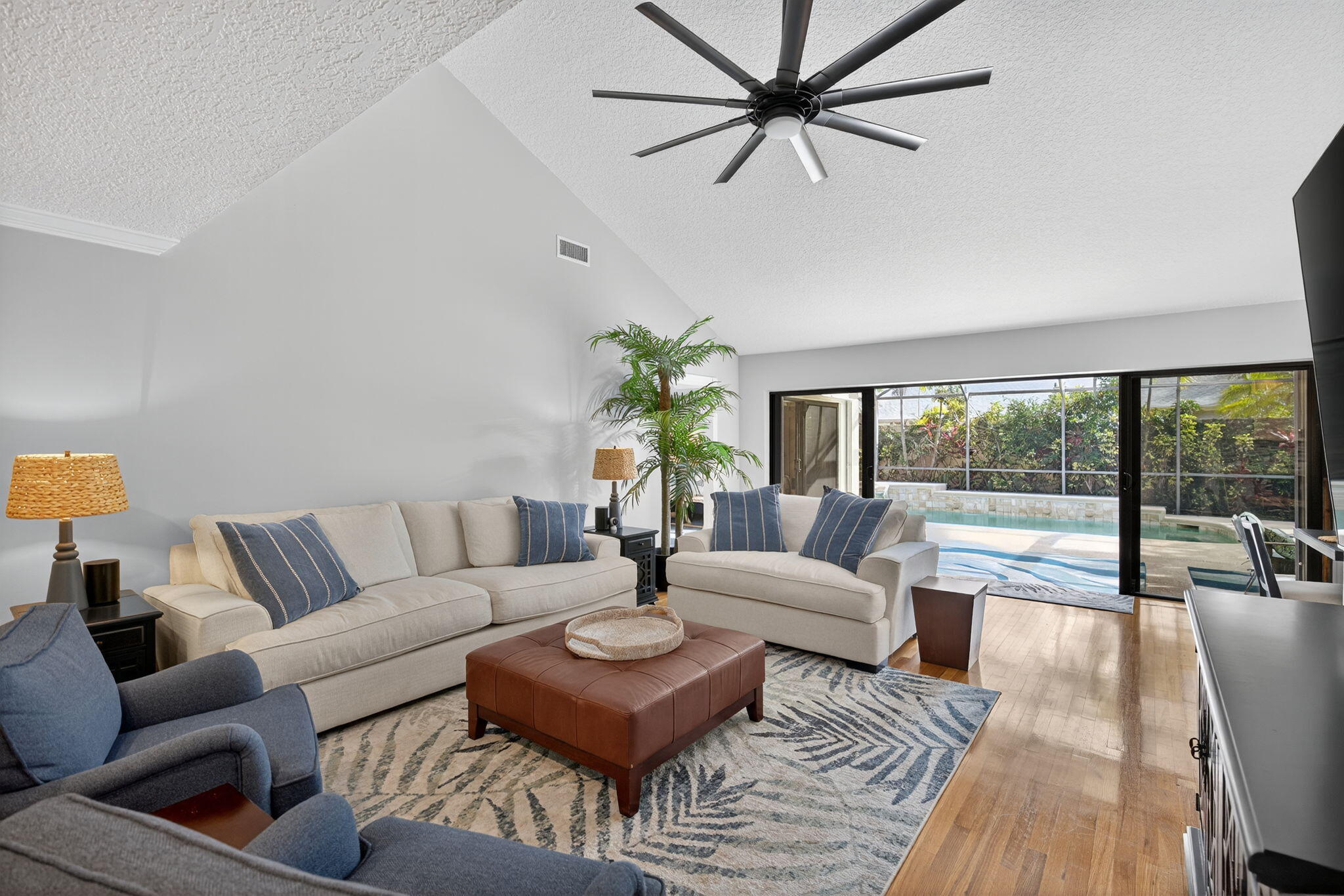 121 Landward Drive Jupiter, FL 33477 - Photo 23 of 80 a living room with furniture and a large window