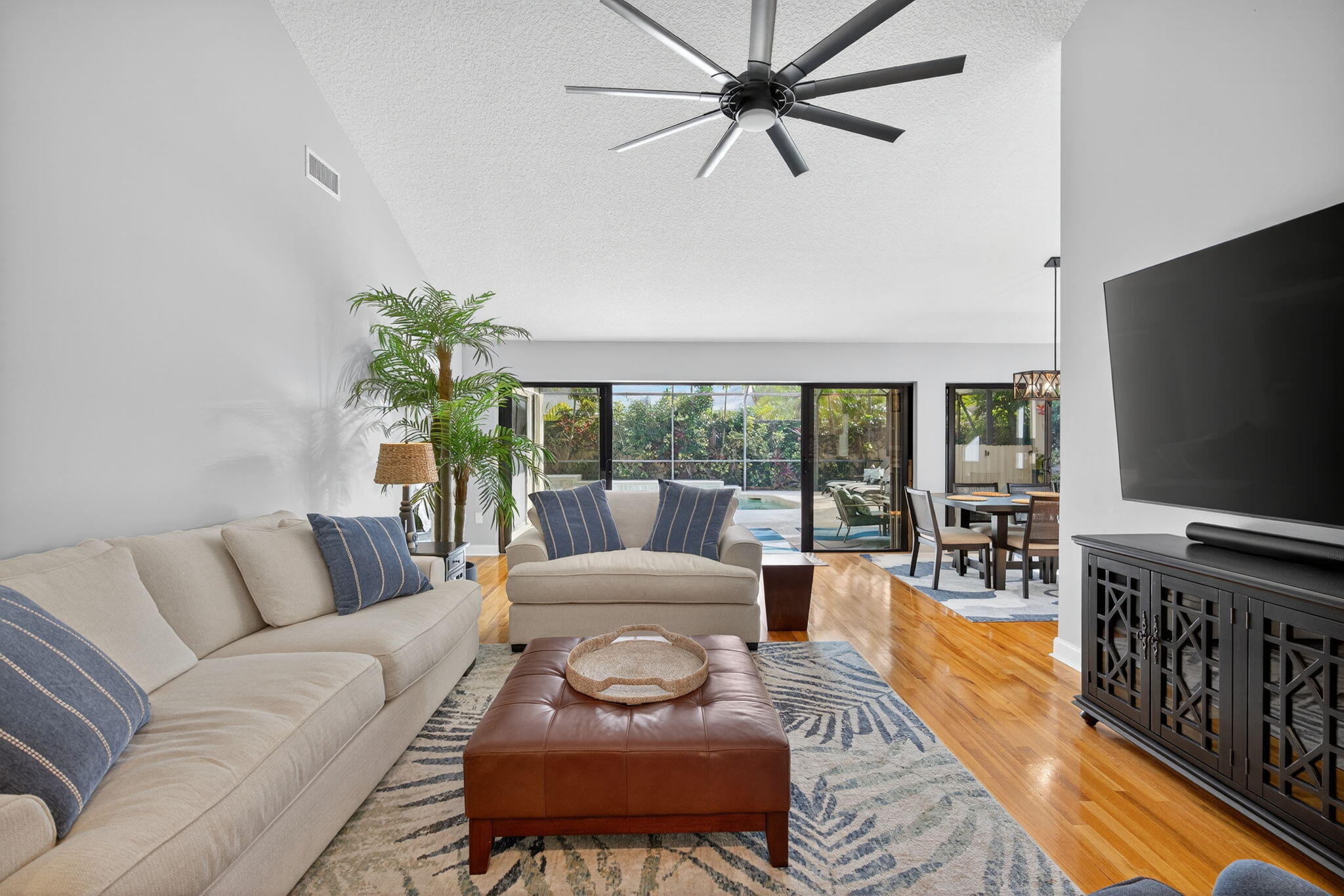 121 Landward Drive Jupiter, FL 33477 - Photo 24 of 80 a living room with furniture and a flat screen tv