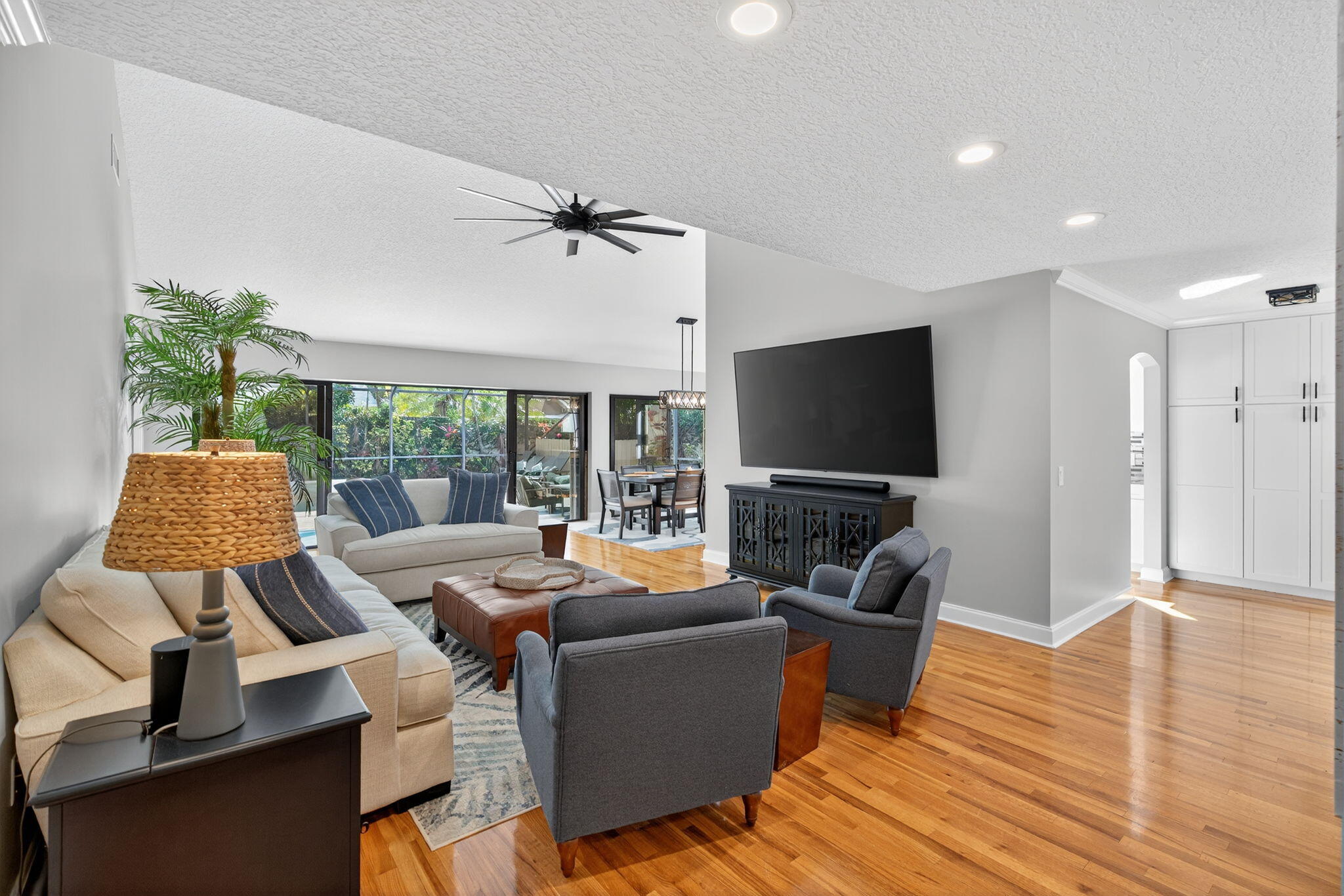 121 Landward Drive Jupiter, FL 33477 - Photo 26 of 80 a living room with furniture and a flat screen tv