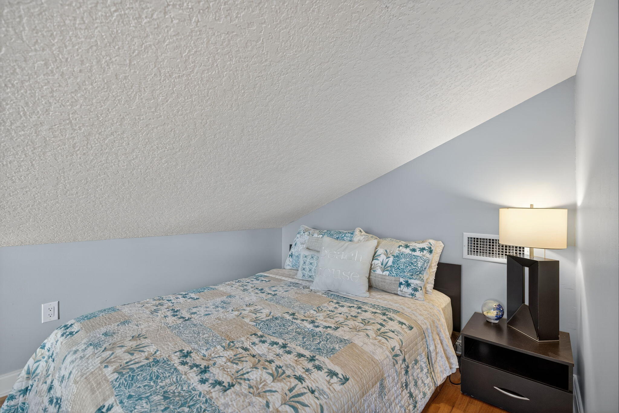 121 Landward Drive Jupiter, FL 33477 - Photo 52 of 80 a bedroom with a bed and a lamp