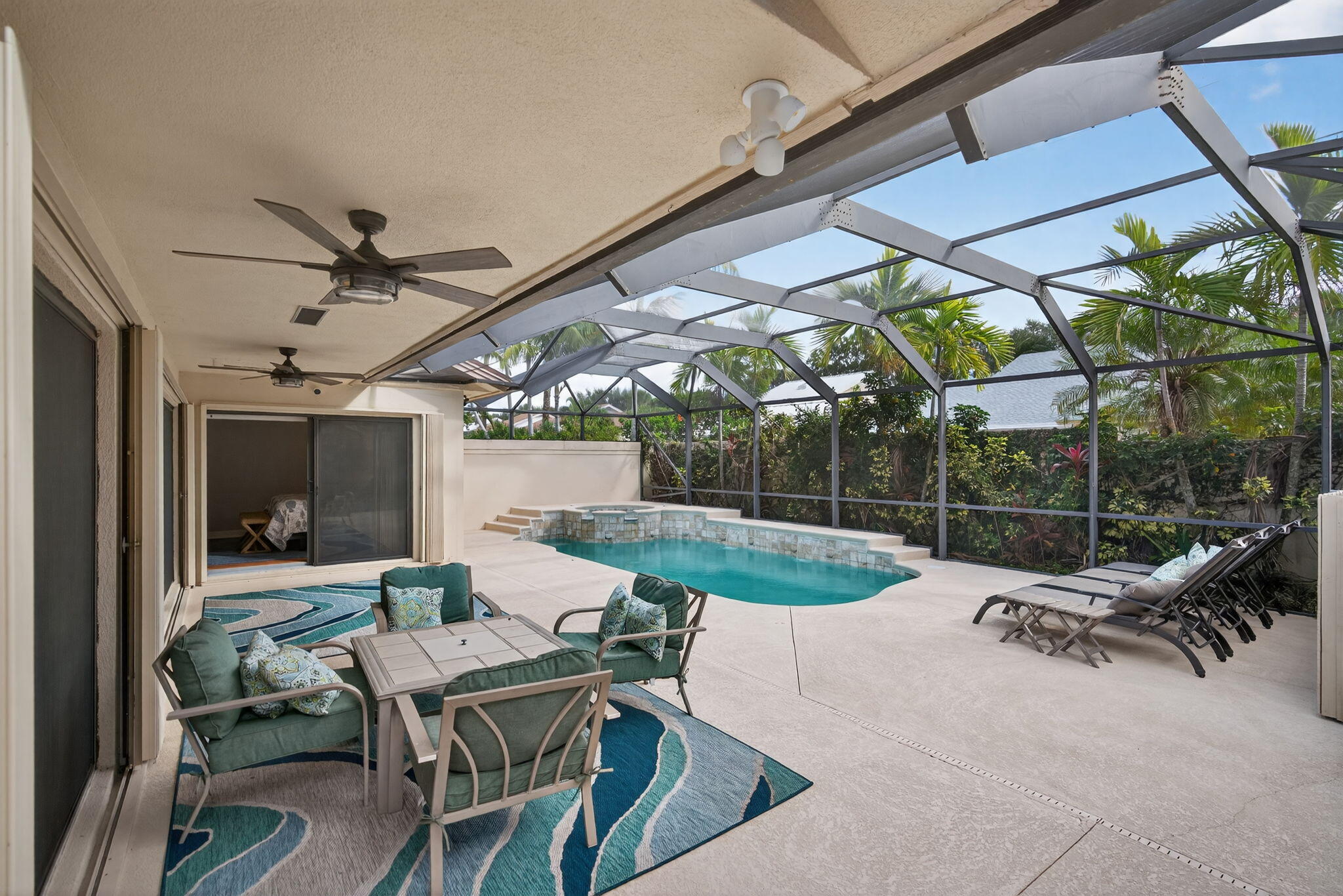 121 Landward Drive Jupiter, FL 33477 - Photo 7 of 80 a view of a patio with a table and chairs