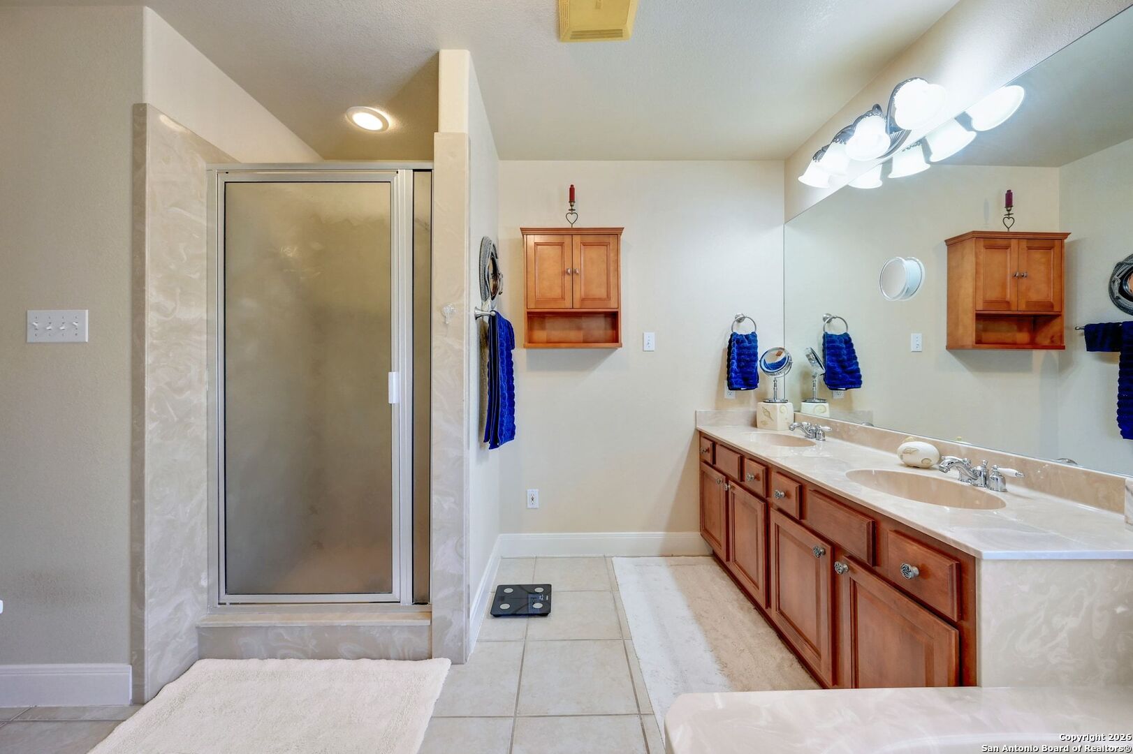1367 Rolling Hills Road Blanco, TX 78606 - Photo 16 of 30 a bathroom with a tub sink and mirror