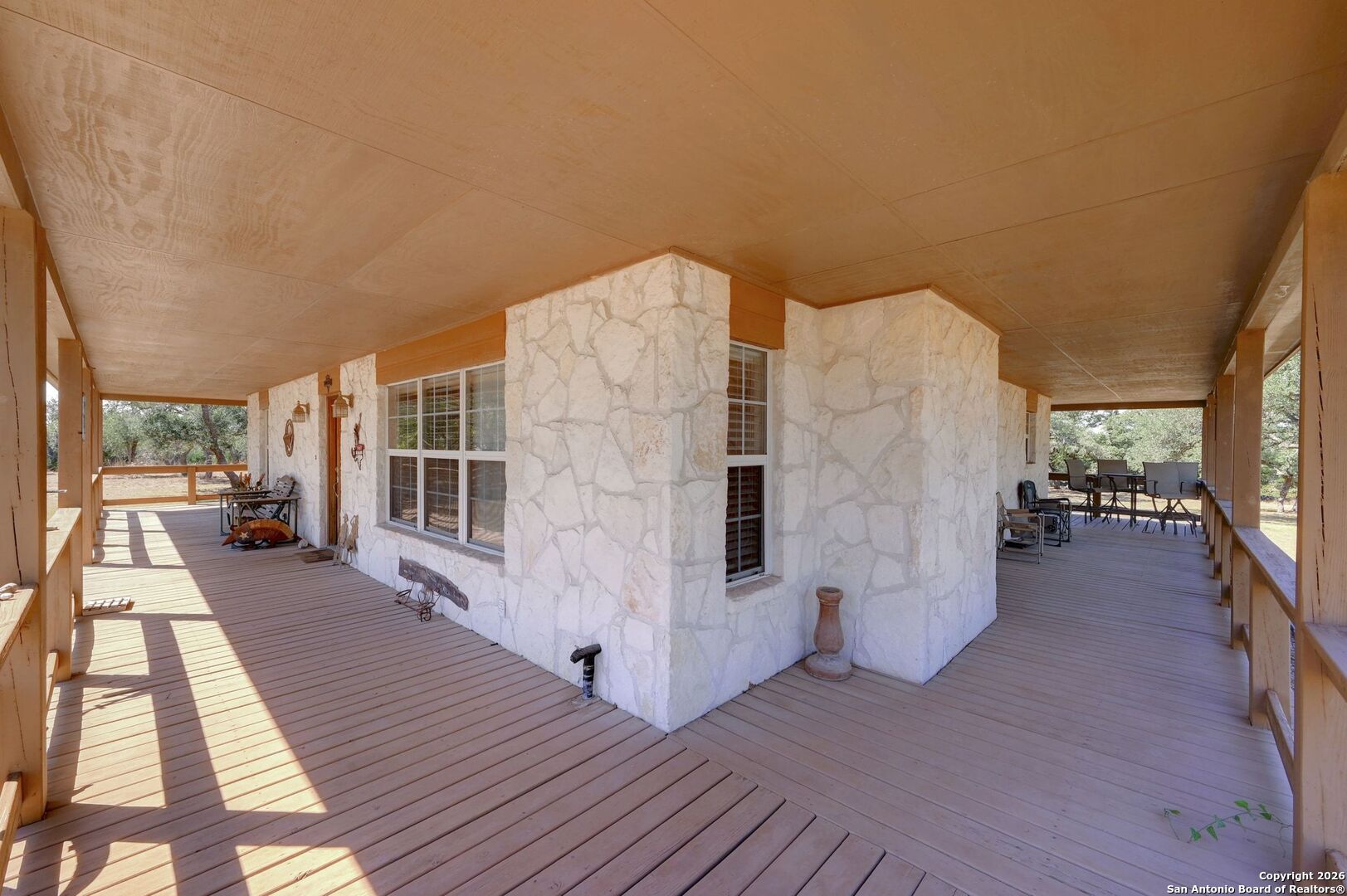 1367 Rolling Hills Road Blanco, TX 78606 - Photo 26 of 30 a view of a balcony with wooden floor