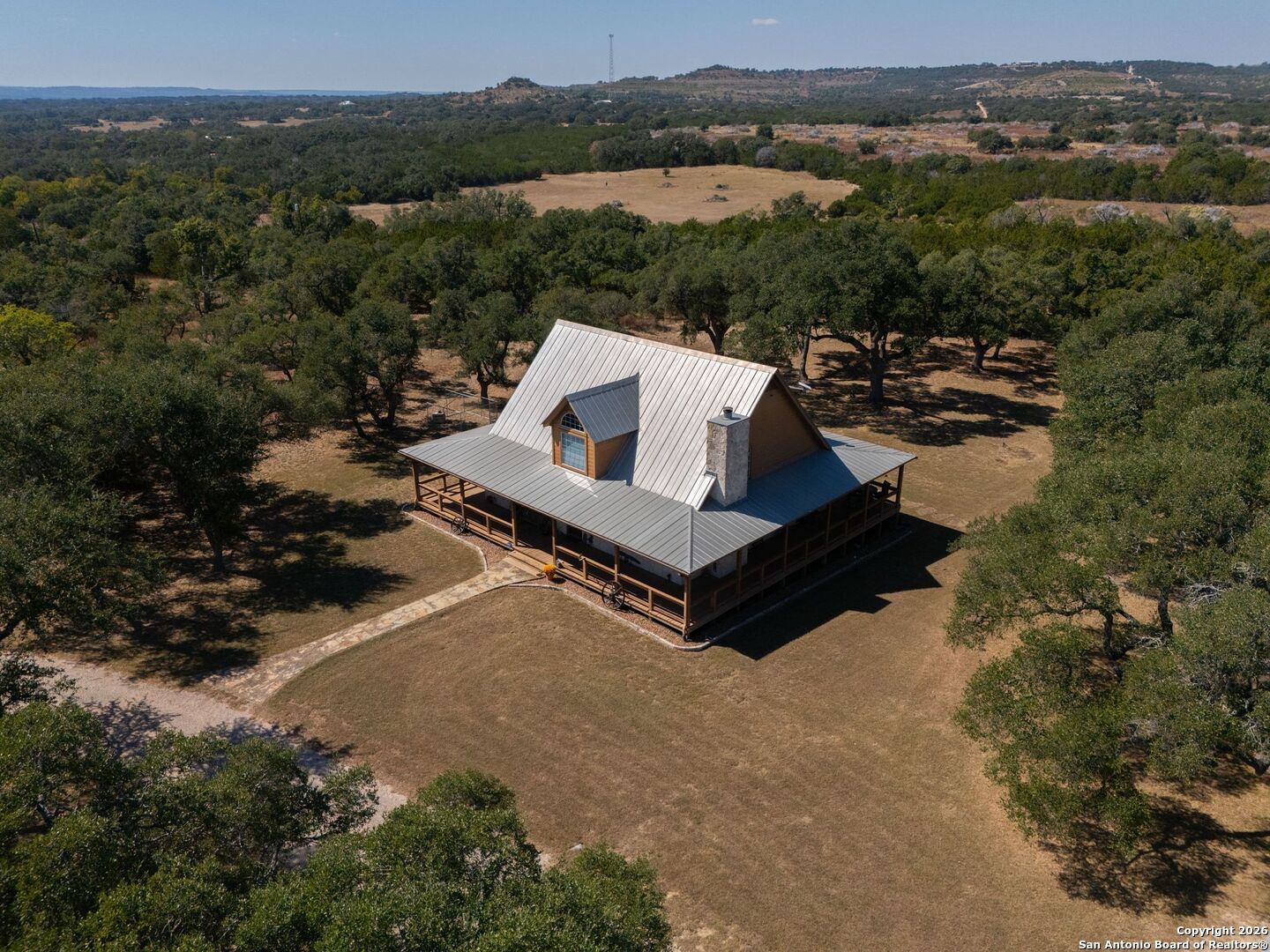 1367 Rolling Hills Road Blanco, TX 78606 - Photo 29 of 30 an aerial view of a house with a yard and lake view