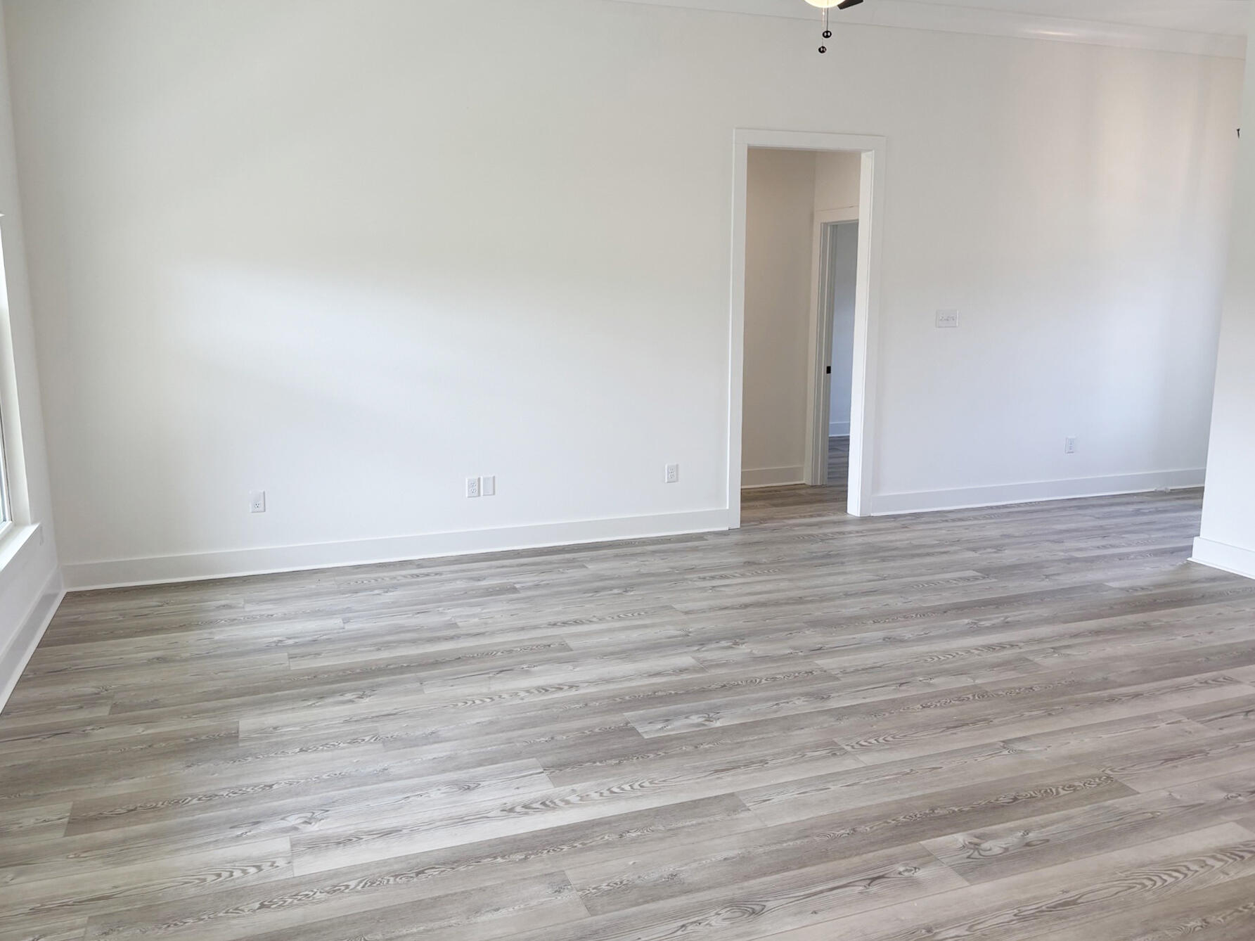 5800 Del Rio Crossing Crestview, FL 32539 - Photo 7 of 24 a view of an empty room with wooden floor