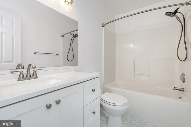a view of a bathroom with a shower and a window