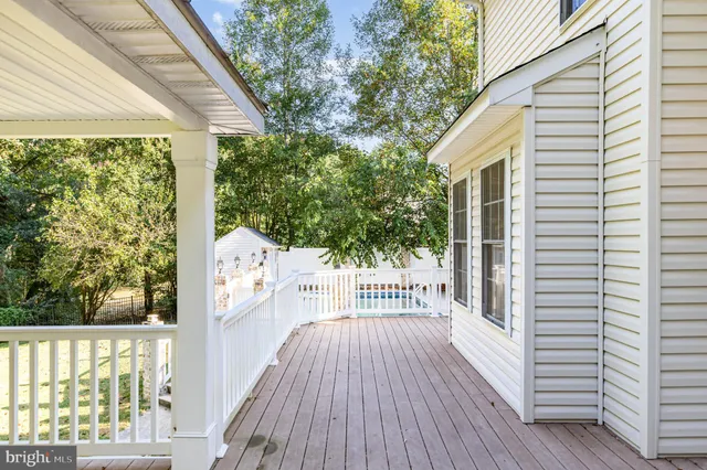 a view of a balcony with wooden floor