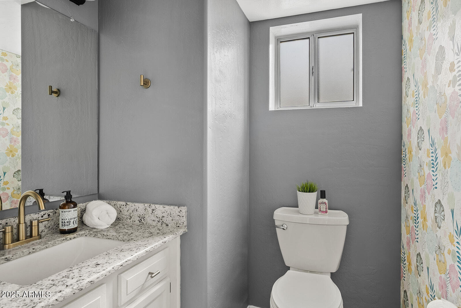 861 West Shellfish Drive Gilbert, AZ 85233 - Photo 13 of 30 a bathroom with a toilet sink and mirror