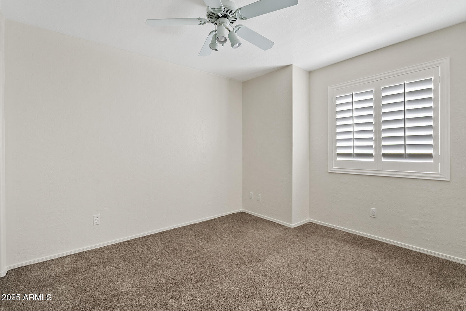 861 West Shellfish Drive Gilbert, AZ 85233 - Photo 19 of 30 an empty room with windows and fan