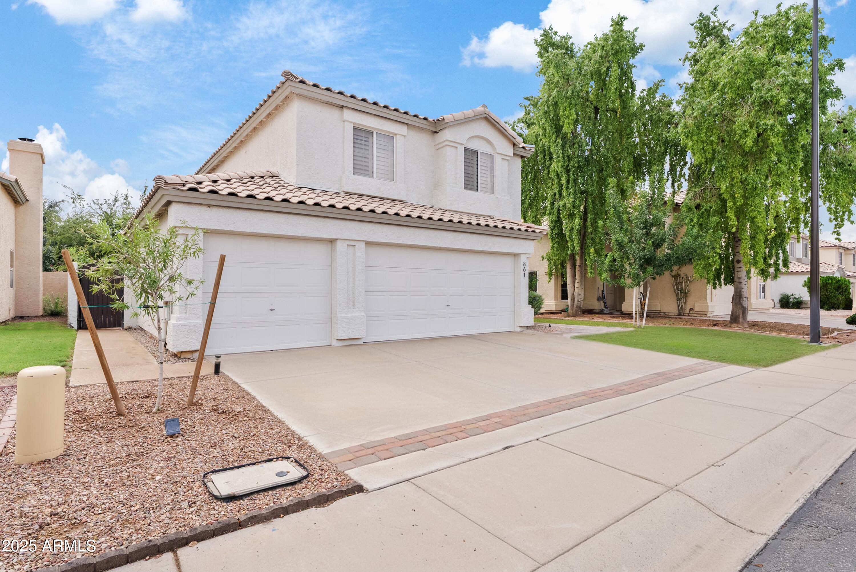 861 West Shellfish Drive Gilbert, AZ 85233 - Photo 30 of 30 a front view of a house with garden