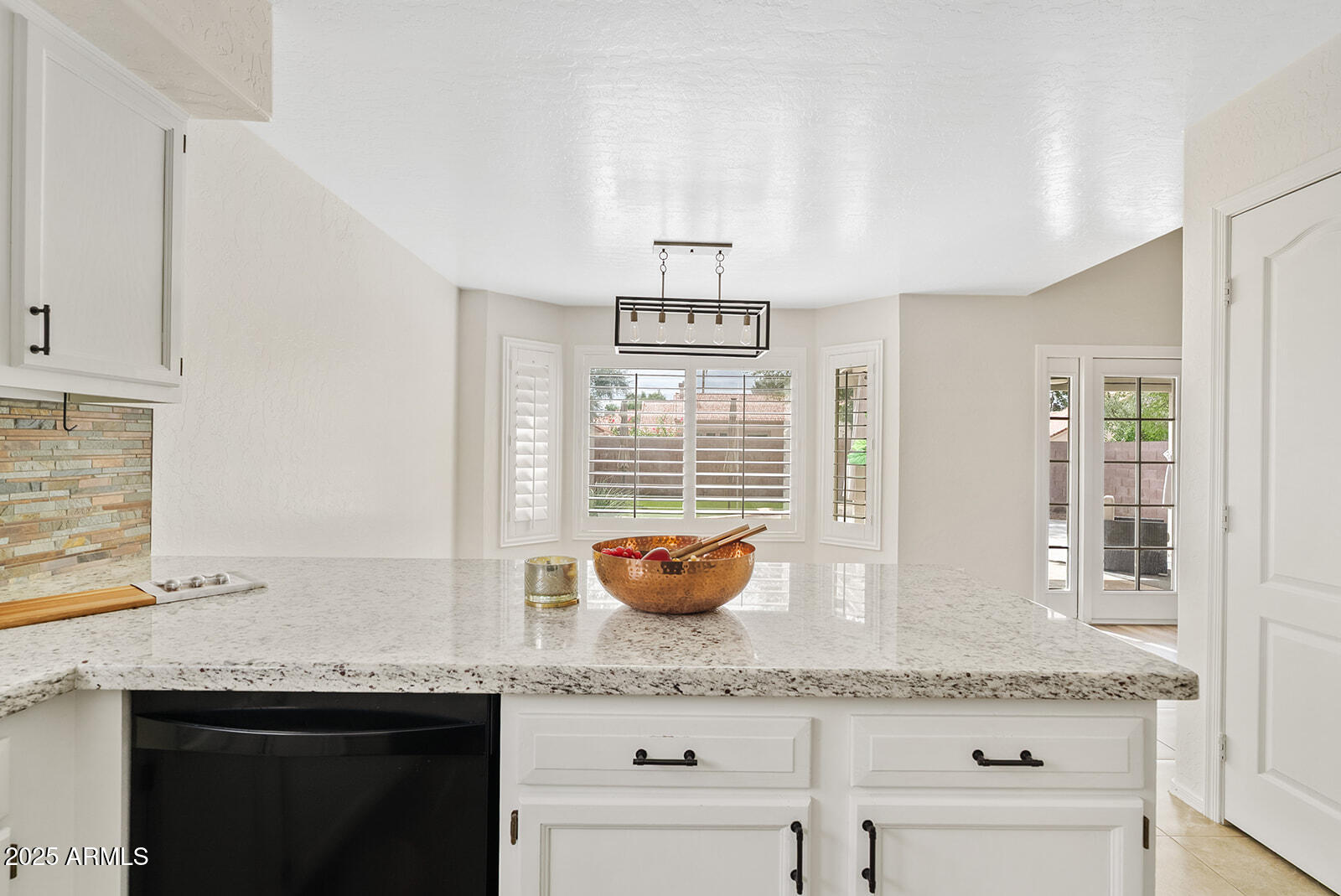 861 West Shellfish Drive Gilbert, AZ 85233 - Photo 8 of 30 a kitchen with granite countertop a stove and cabinets