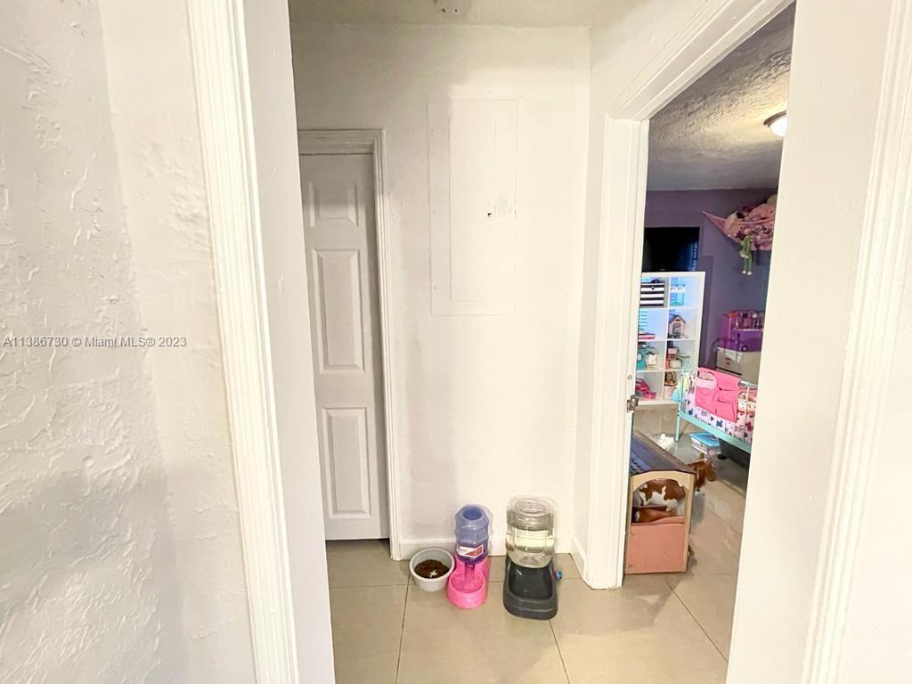 451 Northwest 82nd Street Miami, FL 33150 - Photo 12 of 27 Hall to extra rooms