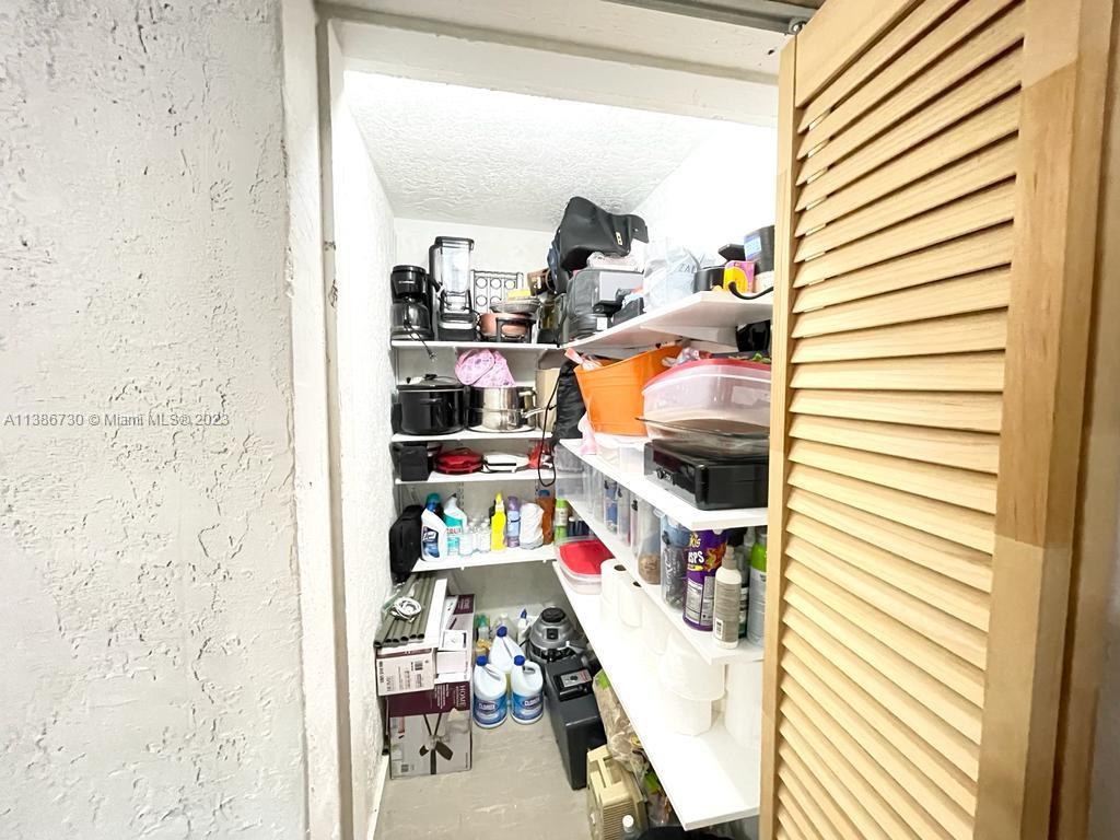451 Northwest 82nd Street Miami, FL 33150 - Photo 10 of 27 Master Bedroom extra Closet next to kitcgen