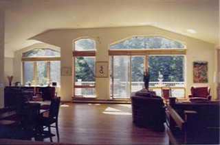 1850 South Frontage Road West, Unit 5 Vail, CO 81657 - Photo 3 of 4 a living room with furniture and a large window