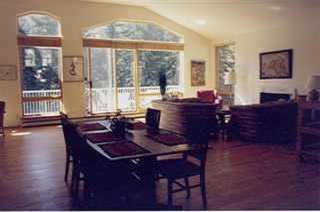 1850 South Frontage Road West, Unit 5 Vail, CO 81657 - Photo 4 of 4 a living room with furniture and large windows