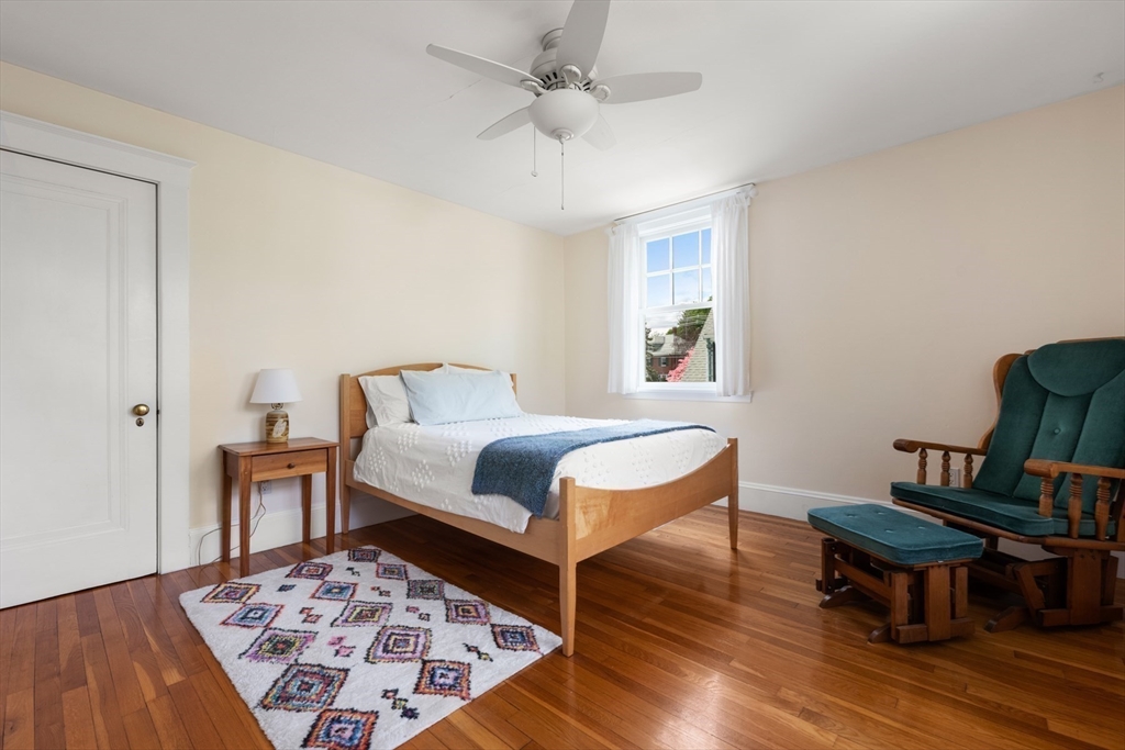 8 Charlotte Road Marblehead, MA 01945 - Photo 24 of 37 a bedroom with a bed and wooden floor