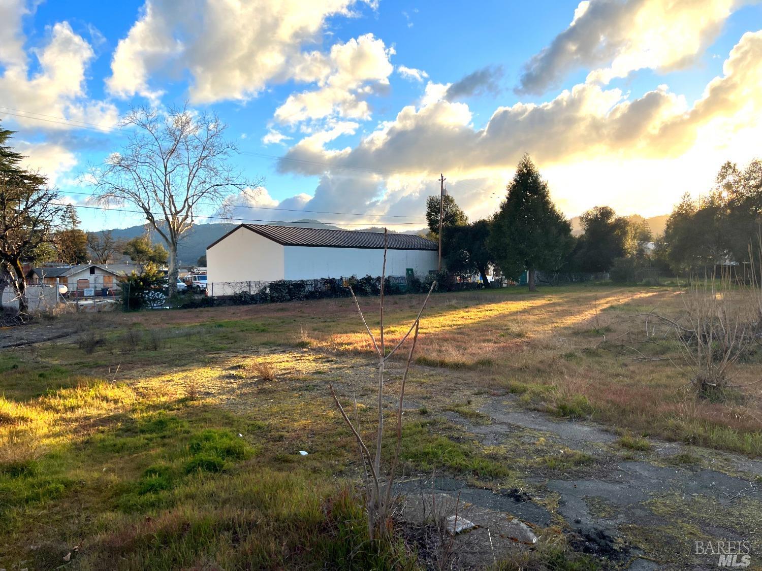 a view of swimming pool with outdoor seating and yard in back