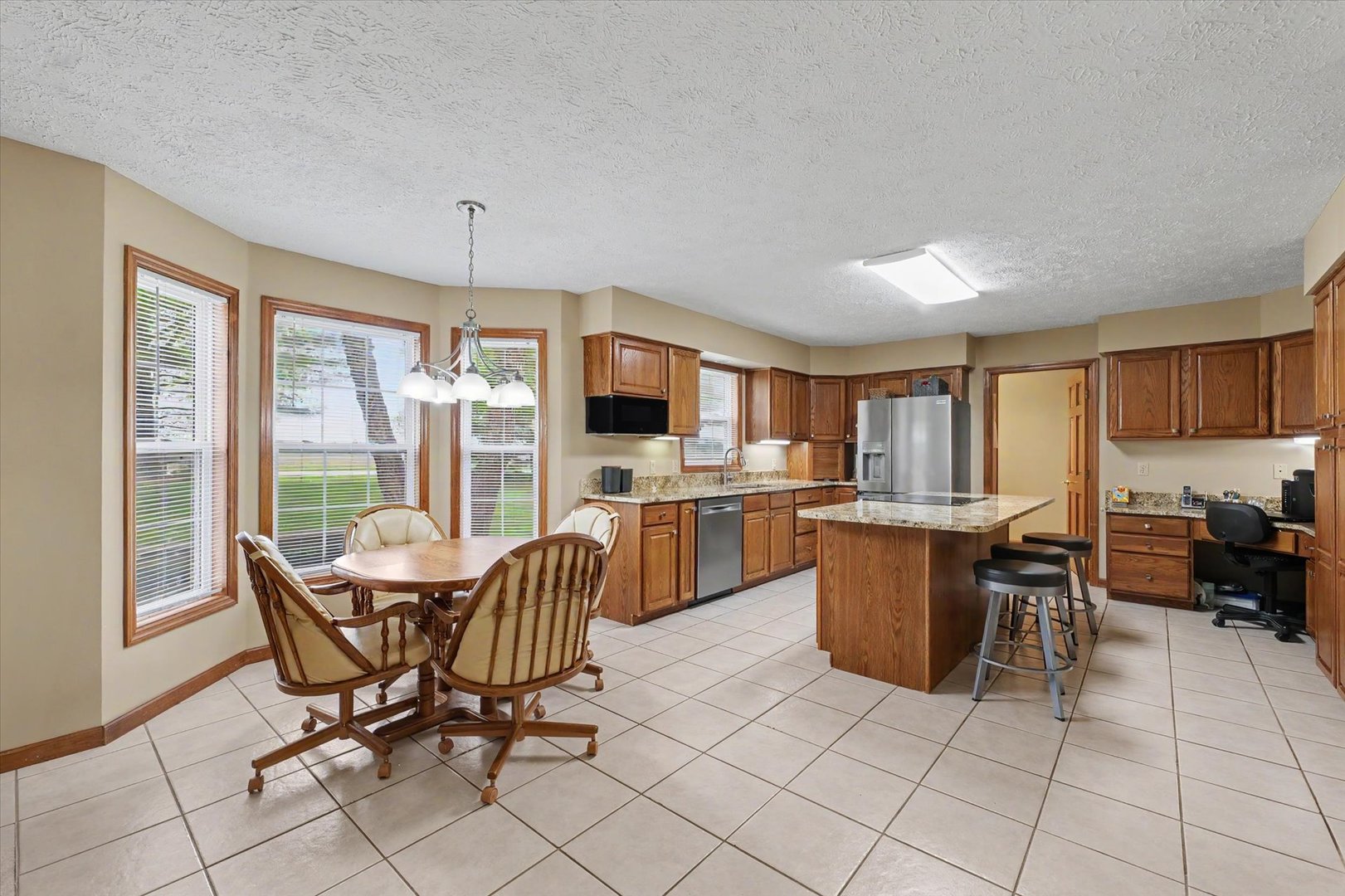 4409 Copper Ridge Road Champaign, IL 61822 - Photo 12 of 40 a view of a dining room with furniture window and outside view