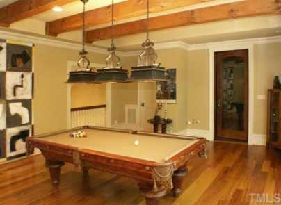 3120 Cone Manor Lane Raleigh, NC 27613 - Photo 10 of 11 Open bonus room with Australian chestnut floors, hand hewn beams and adjoining wine room