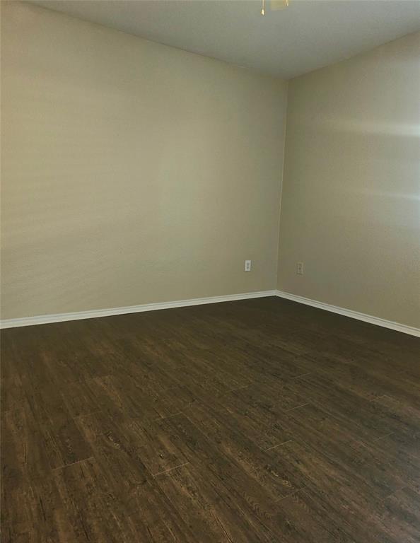 14224 Polo Ranch Street Fort Worth, TX 76052 - Photo 14 of 35 a view of an empty room with wooden floor