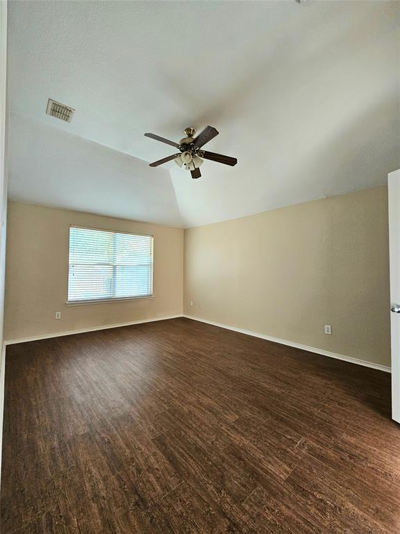 14224 Polo Ranch Street Fort Worth, TX 76052 - Photo 15 of 35 an empty room with wooden floor fan and windows