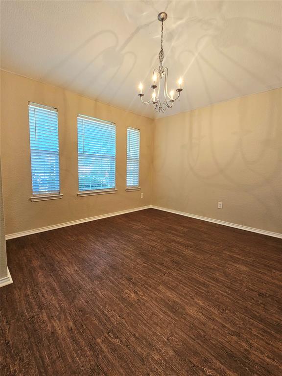 14224 Polo Ranch Street Fort Worth, TX 76052 - Photo 3 of 35 wooden floor in an empty room with a window