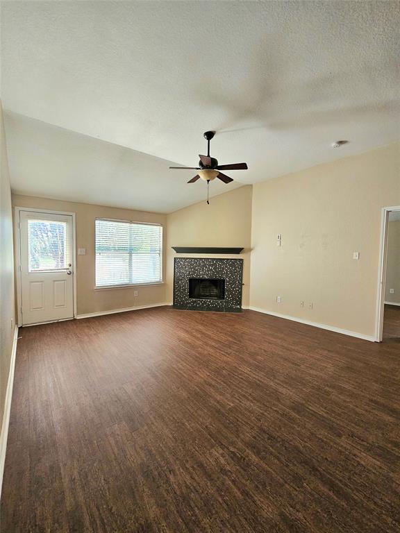 14224 Polo Ranch Street Fort Worth, TX 76052 - Photo 4 of 35 an empty room with windows and fireplace