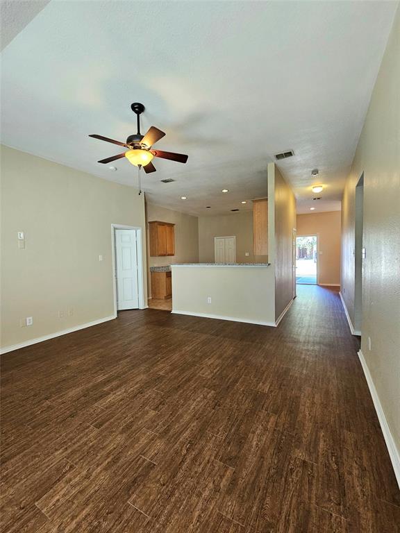 14224 Polo Ranch Street Fort Worth, TX 76052 - Photo 7 of 35 a view of empty room with wooden floor and fan