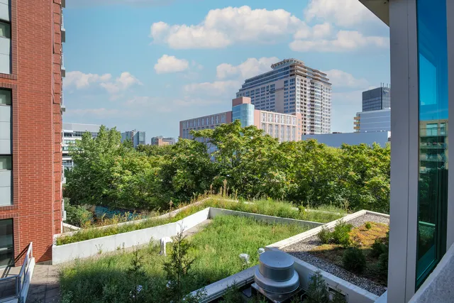 a view of a balcony with an outdoor space and seating area