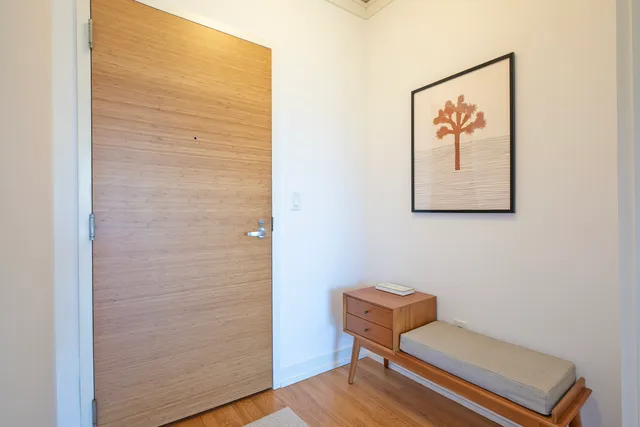 a bench sitting in a bathroom next to a chair
