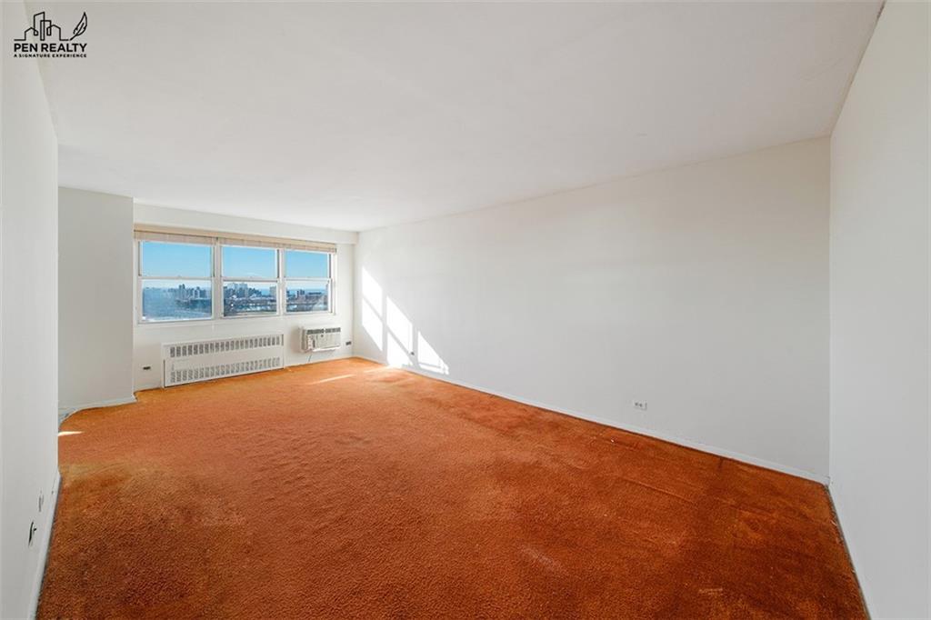 2475 West 16th Street, Unit 18G Brooklyn, NY 11214 - Photo 3 of 15 an empty room with a fireplace