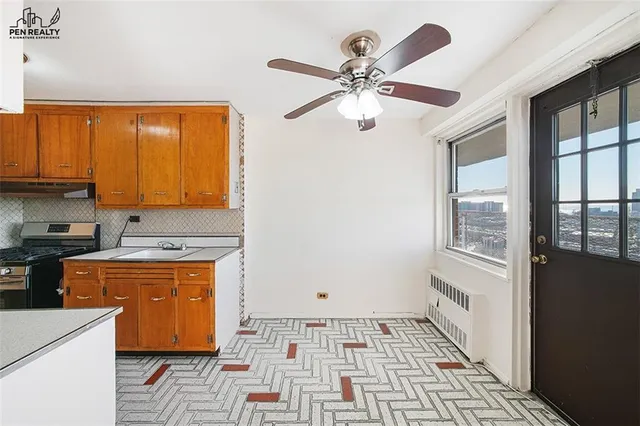 a kitchen with a stove a sink and a refrigerator