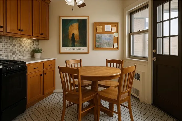a dining room with furniture and window