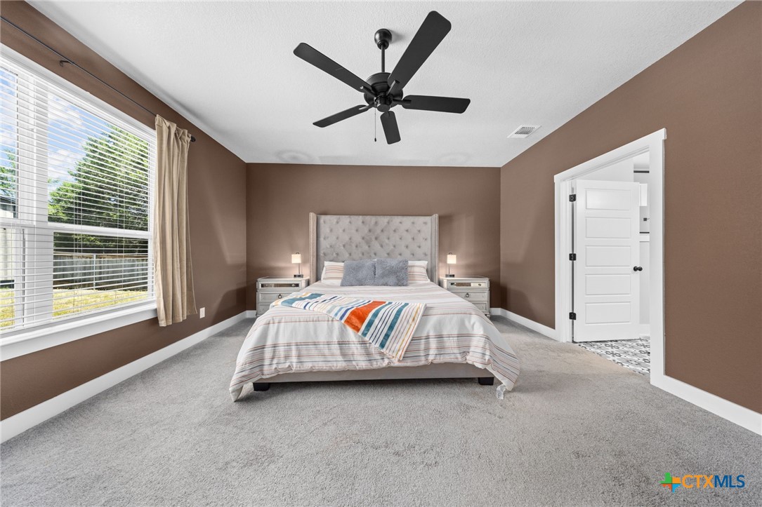 614 South Wheat Road Belton, TX 76513 - Photo 20 of 46 a bedroom with a bed and window