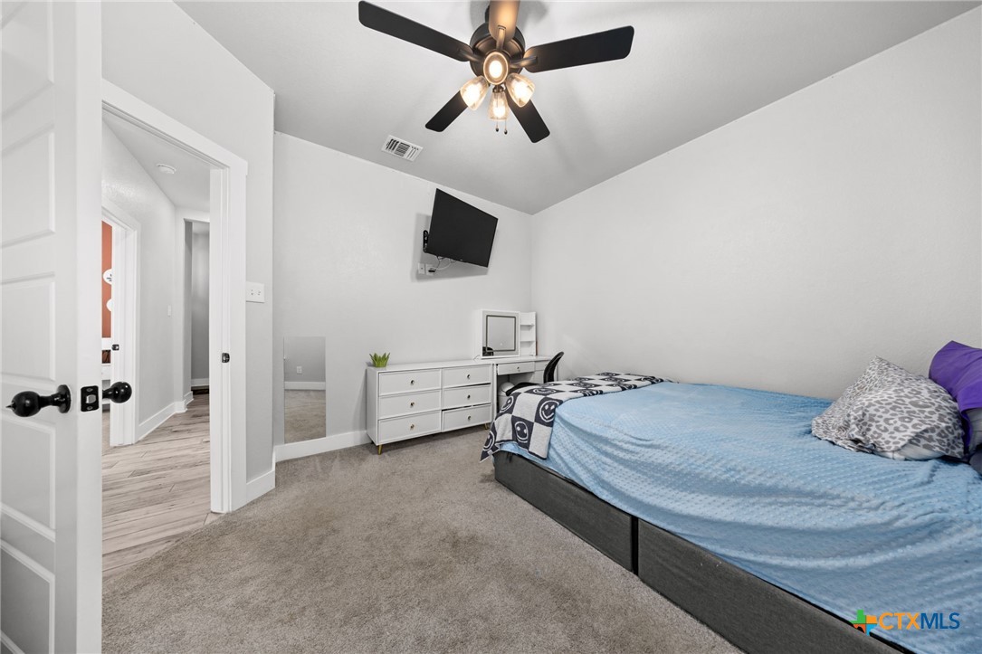 614 South Wheat Road Belton, TX 76513 - Photo 34 of 46 a bedroom with a bed and a tv