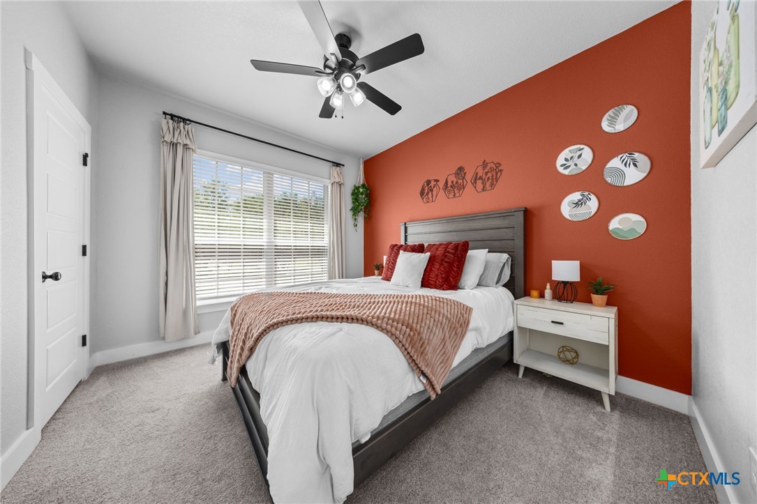 614 South Wheat Road Belton, TX 76513 - Photo 36 of 46 a bedroom with a large bed and a large window